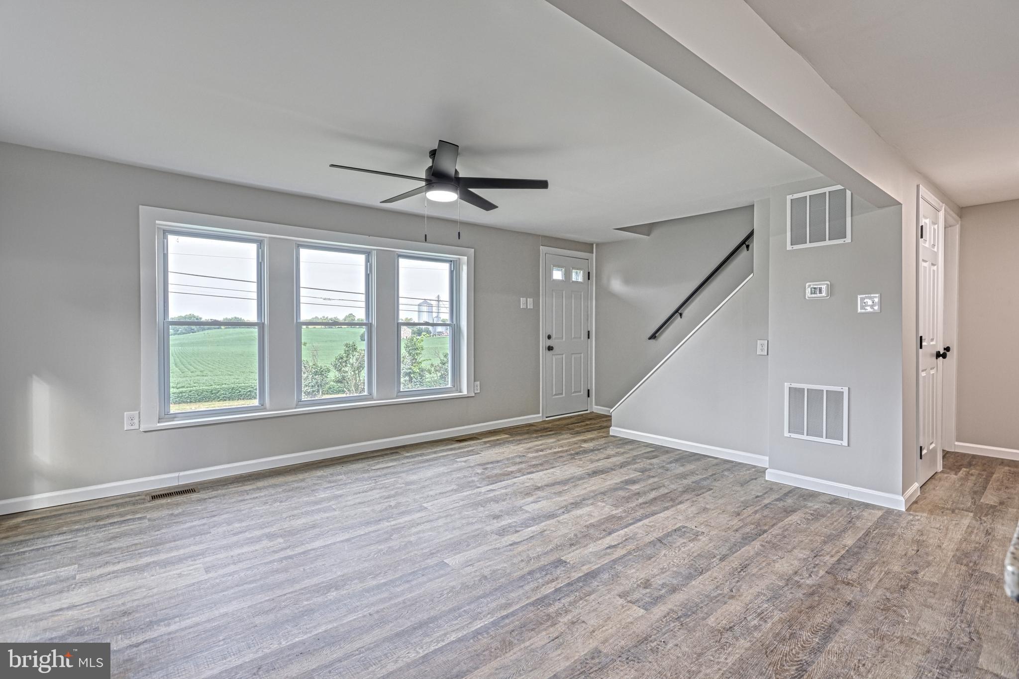 455 Petersburg Road Carlisle, PA 17015 - Photo 30 of 77 a view of empty room with wooden floor and fan