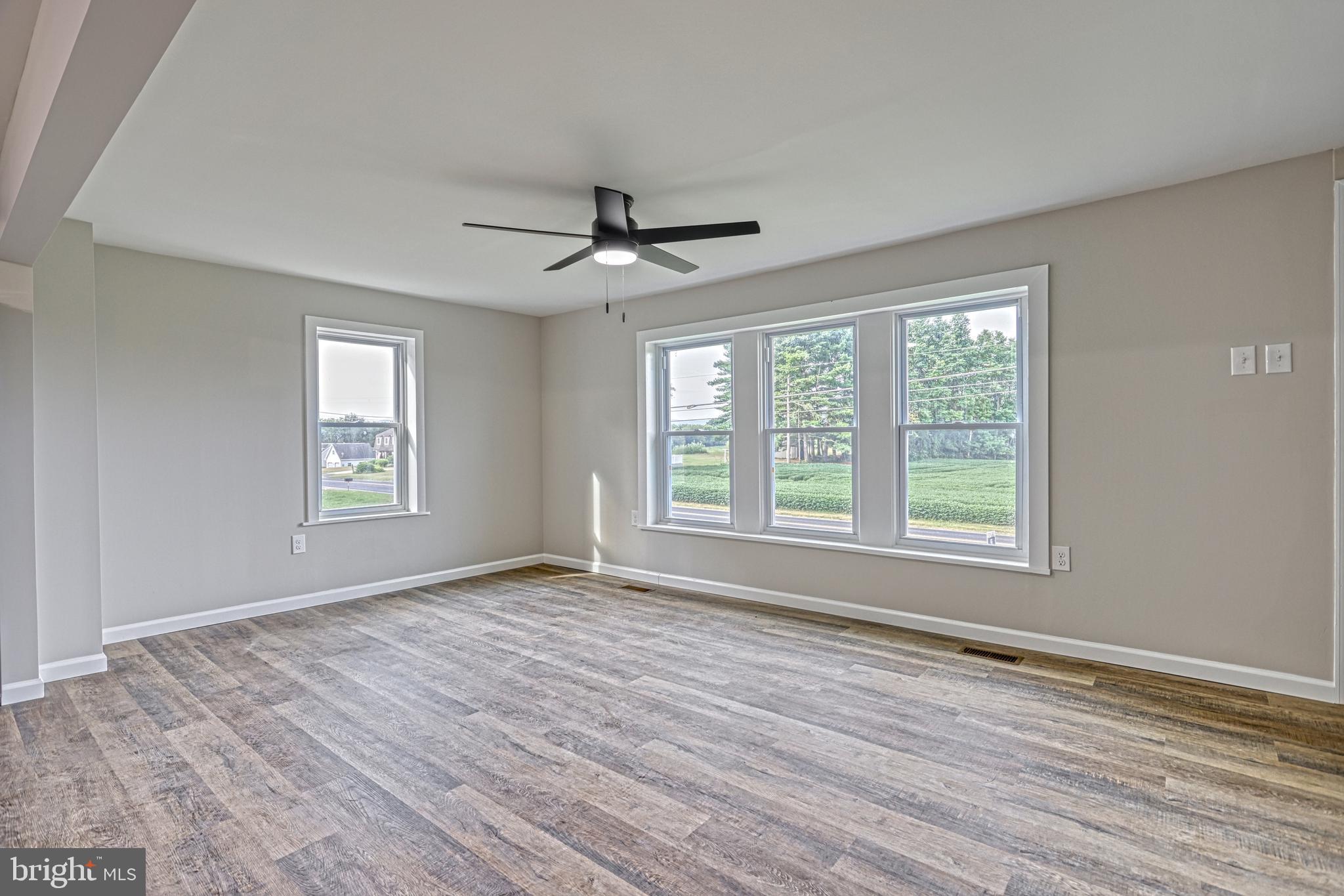 455 Petersburg Road Carlisle, PA 17015 - Photo 31 of 77 a view of an empty room with a window and wooden floor