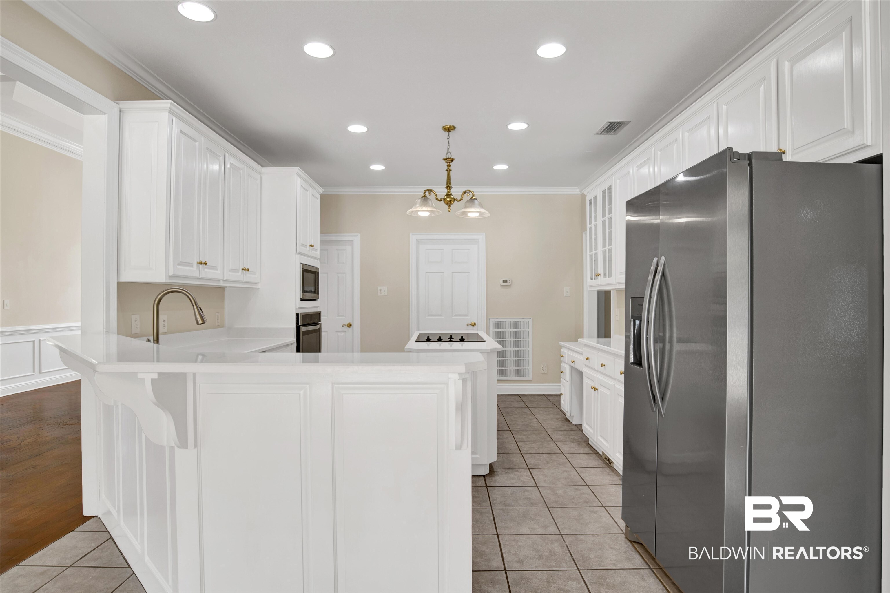 8847 Dawes Lake Road South Mobile, AL 36619 - Photo 8 of 47 Kitchen featuring white cabinetry, light-toned countertops, tile flooring, stainless steel appliances, and recessed lighting