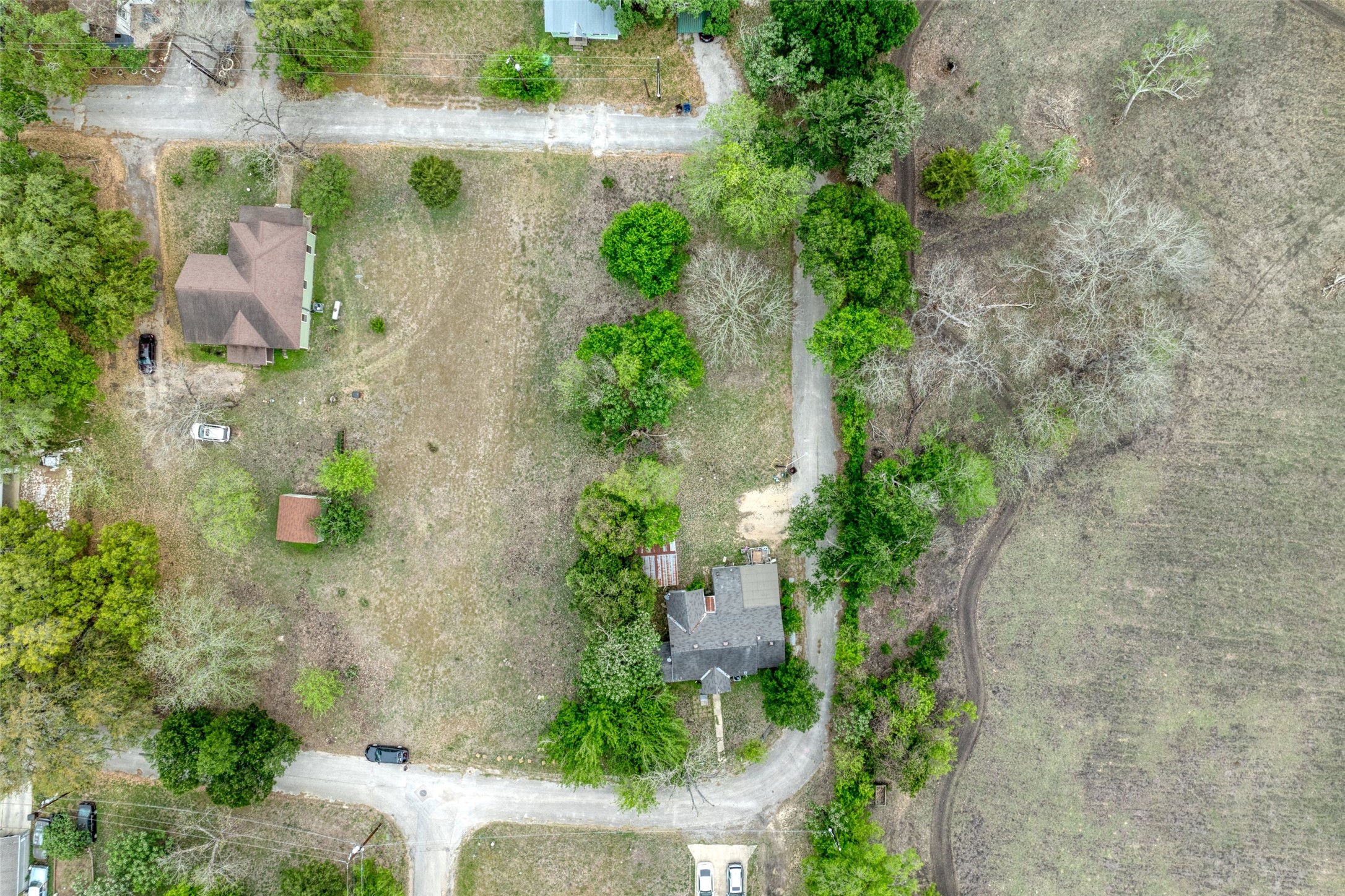 1002 Proctor Street Lockhart, TX 78644 - Photo 8 of 8 an aerial view of a house with outdoor space