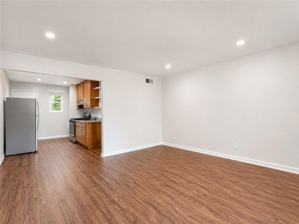 3203 East Point Street, Unit 4 Atlanta, GA 30344 - Photo 3 of 18 a view of empty room with wooden floor