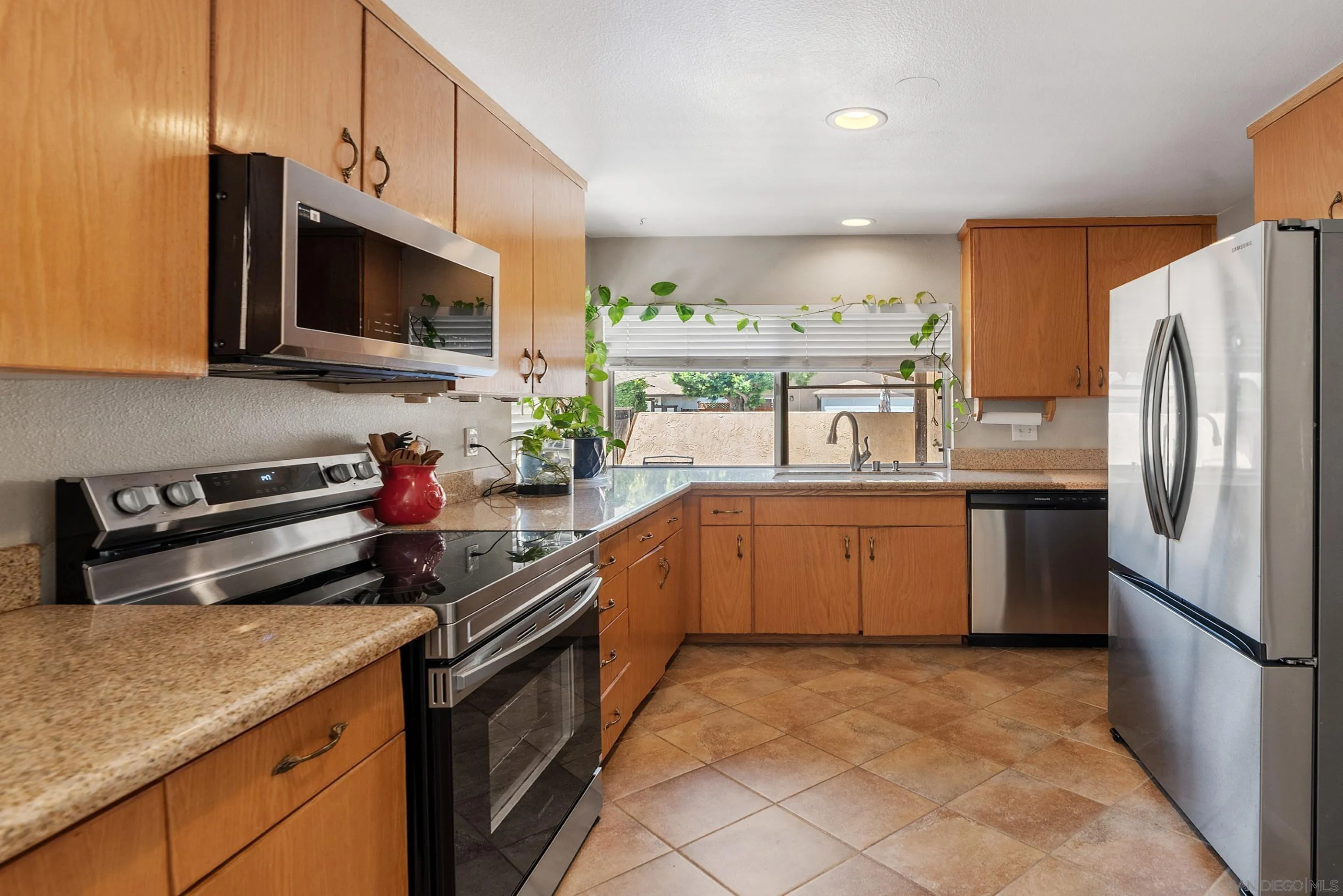 2268 Village Road Escondido, CA 92026 - Photo 11 of 43 a kitchen with a sink stove and refrigerator