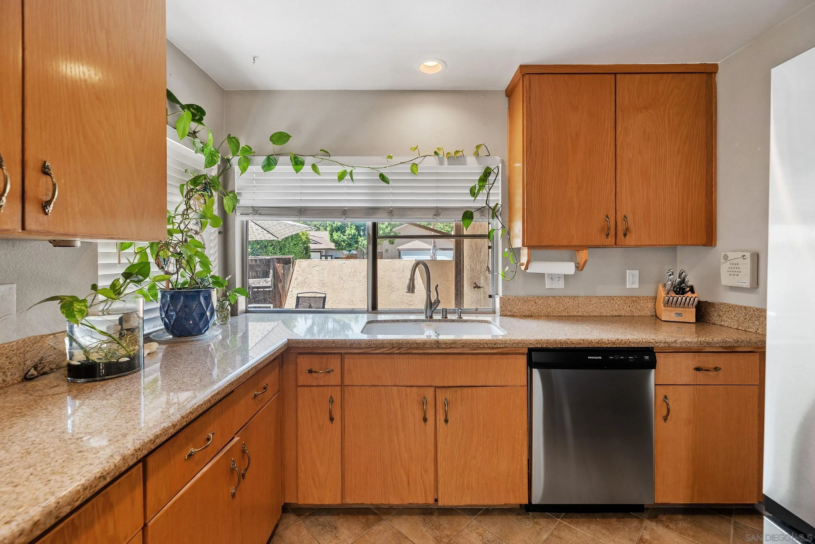 2268 Village Road Escondido, CA 92026 - Photo 13 of 43 a kitchen with a sink and cabinets