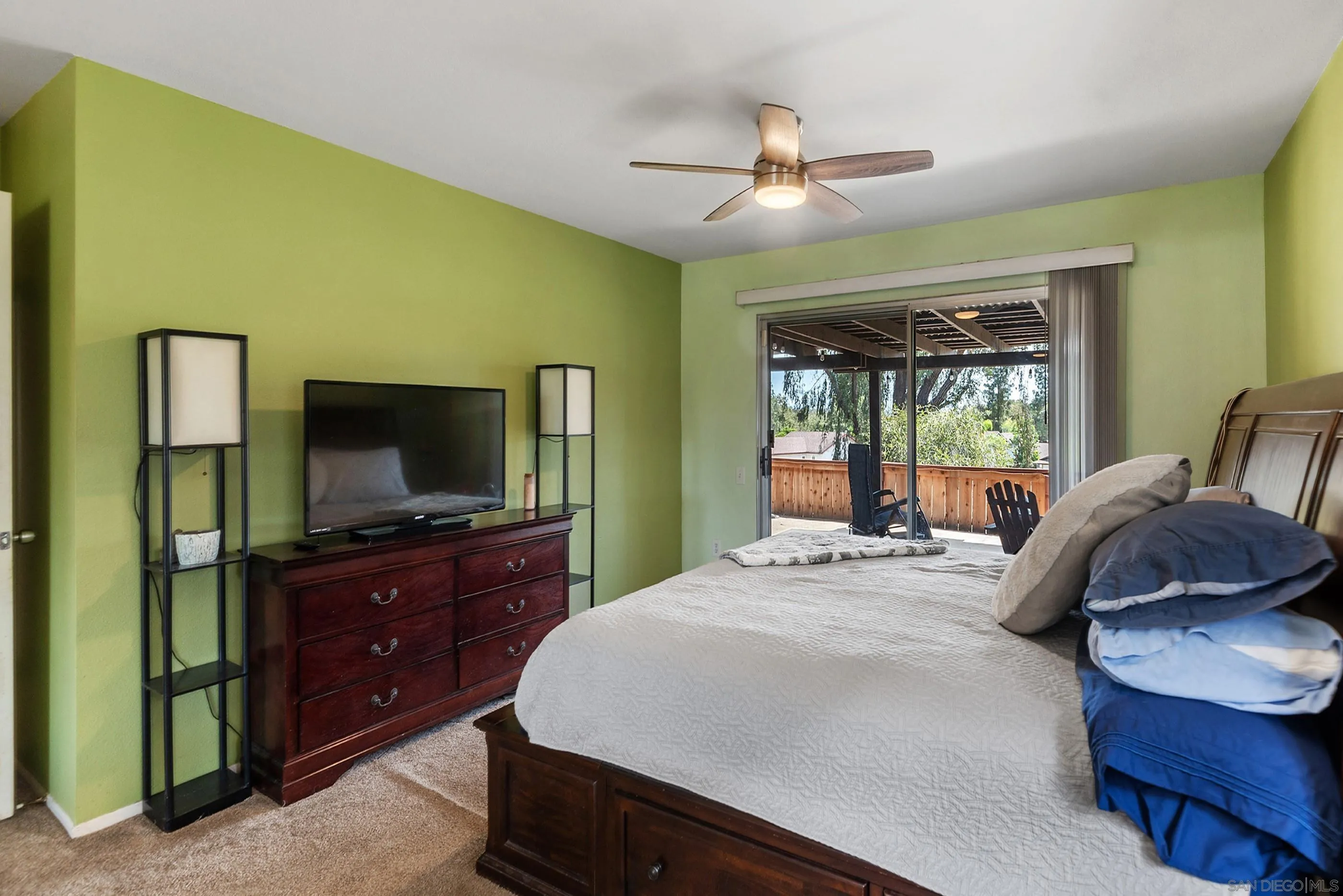 2268 Village Road Escondido, CA 92026 - Photo 21 of 43 a bedroom with a bed and a flat tv screen on dresser