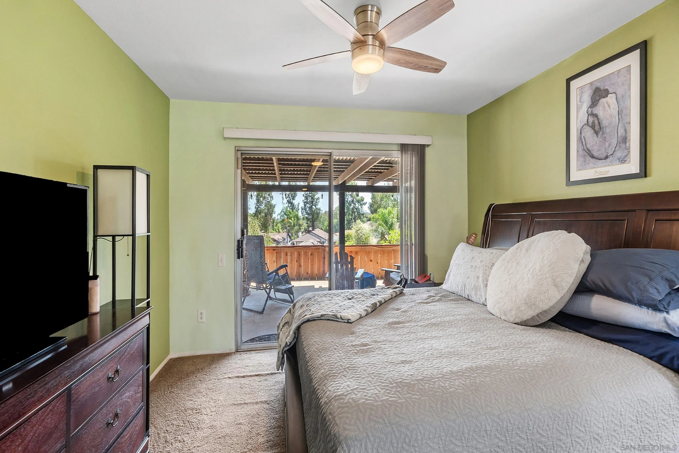 2268 Village Road Escondido, CA 92026 - Photo 23 of 43 a bedroom with a large bed and a flat screen tv