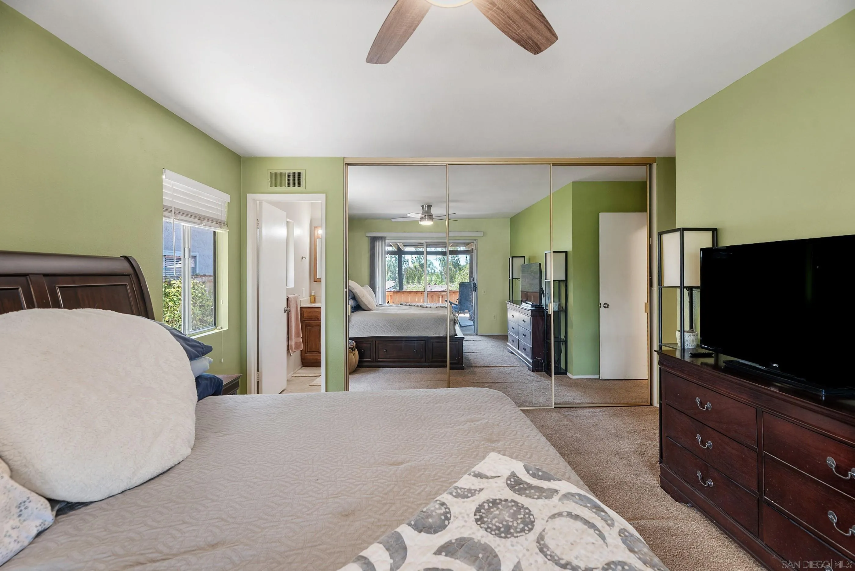 2268 Village Road Escondido, CA 92026 - Photo 24 of 43 a bedroom with furniture and a flat screen tv