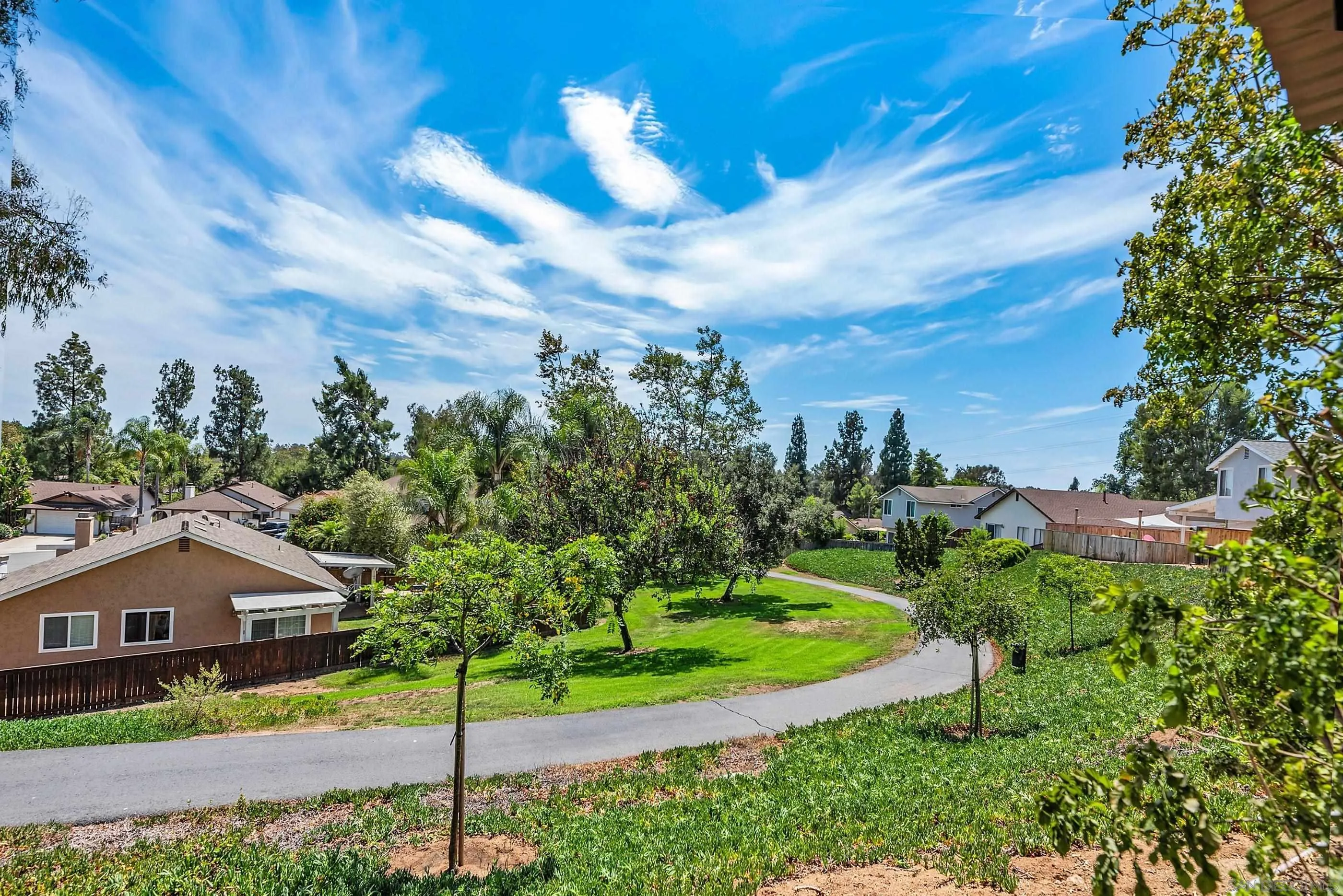 2268 Village Road Escondido, CA 92026 - Photo 36 of 43 a view of a house with a big yard and large trees