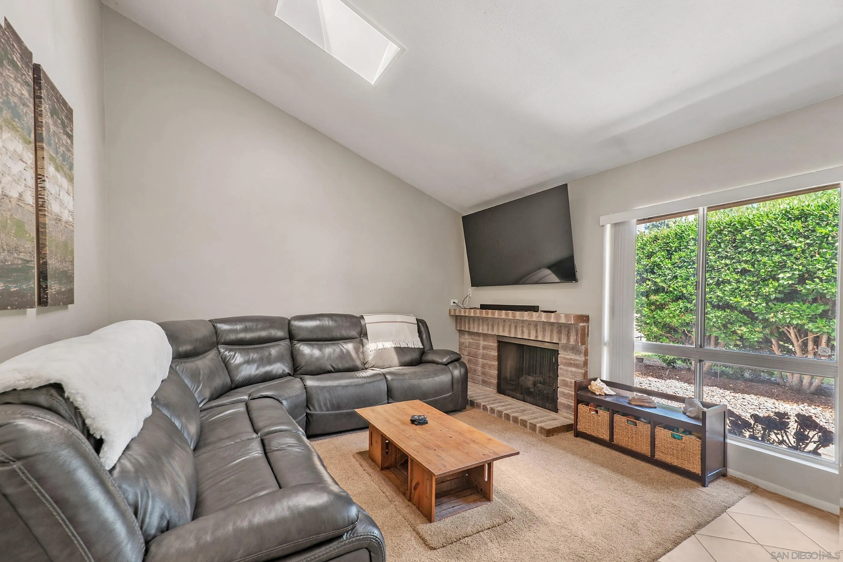 2268 Village Road Escondido, CA 92026 - Photo 5 of 43 a living room with furniture a fireplace and a flat screen tv