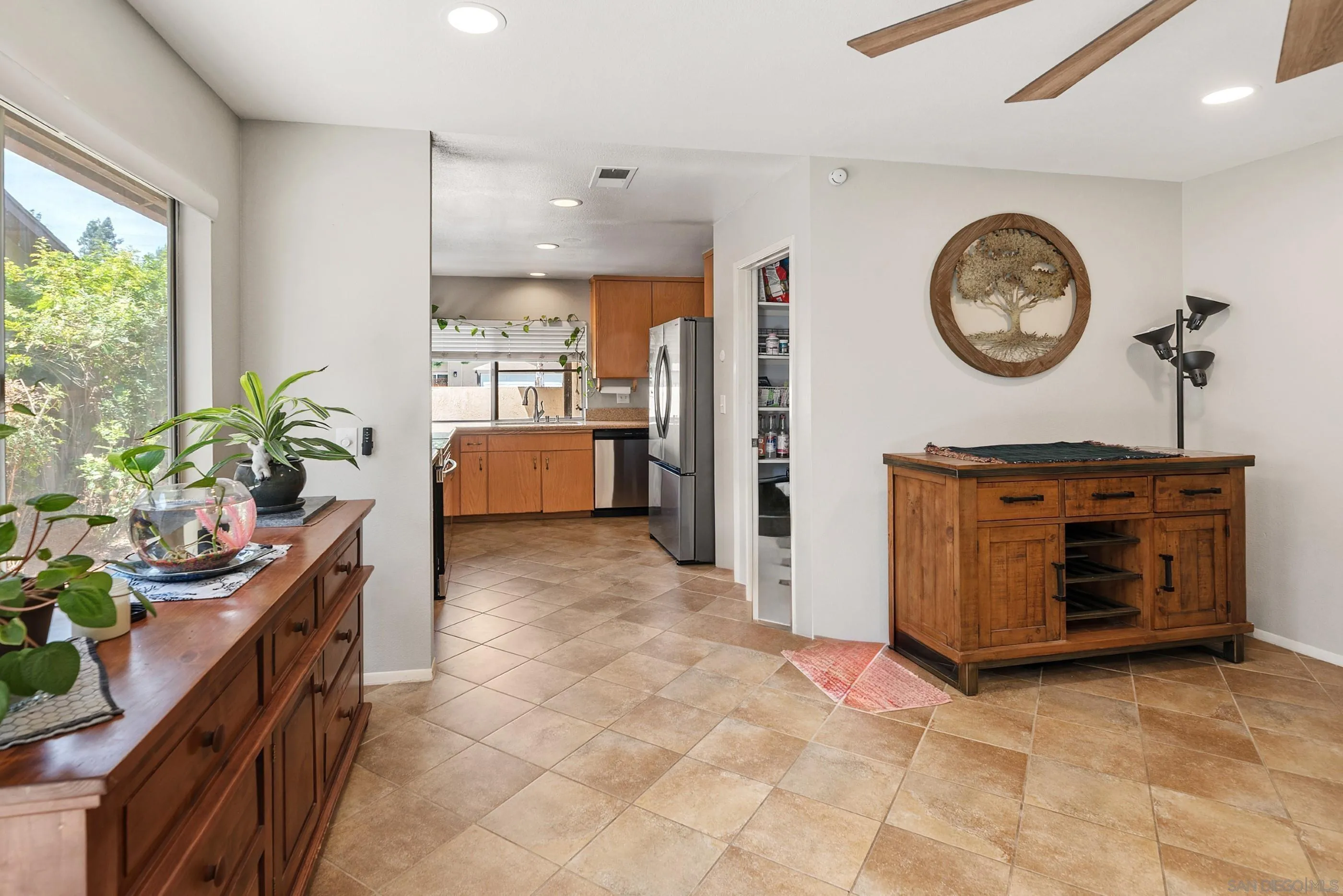 2268 Village Road Escondido, CA 92026 - Photo 10 of 43 a very nice looking room with a large window and a clock
