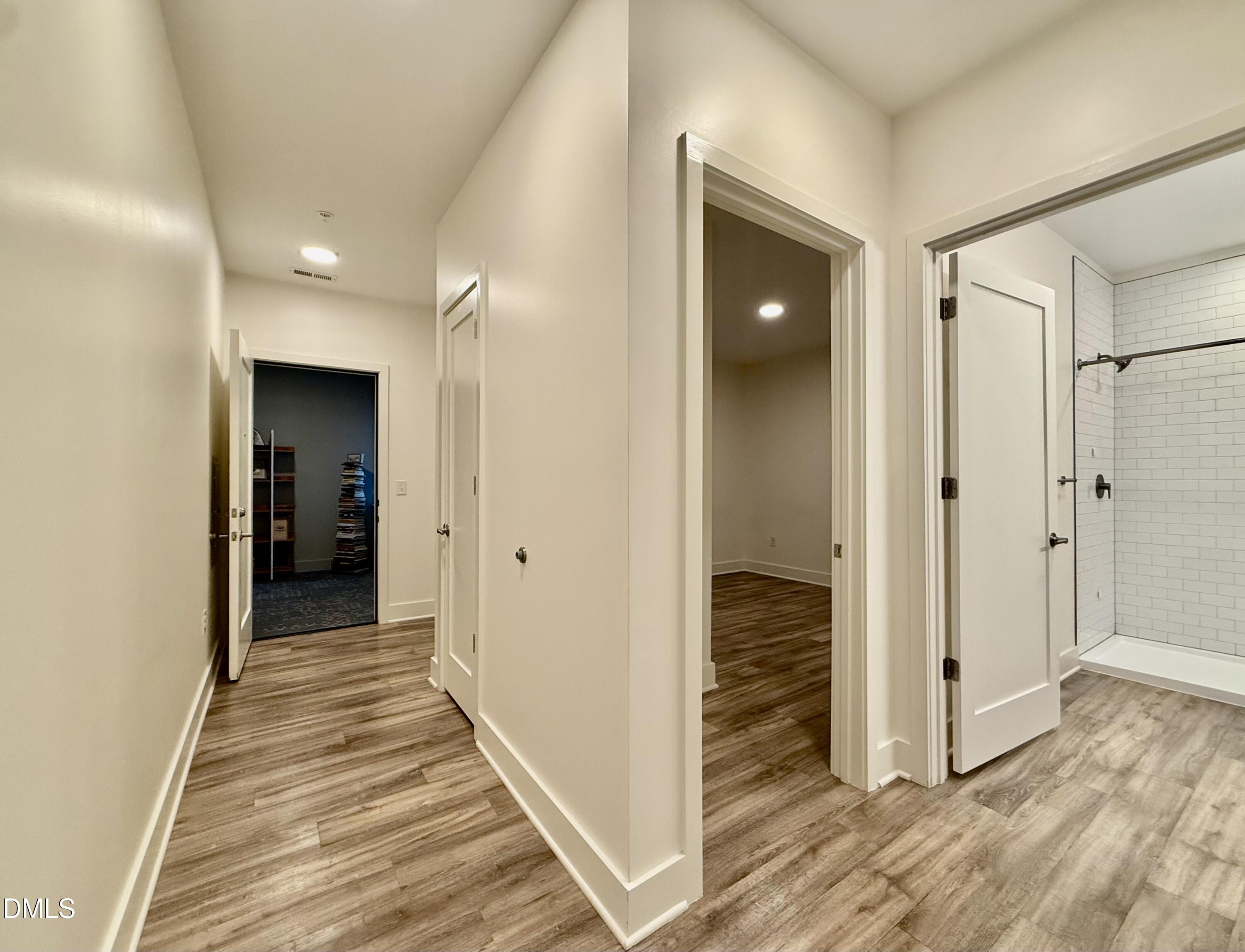 610 Trent Drive, Unit 403 Durham, NC 27705 - Photo 11 of 51 a view of a hallway with wooden floor and staircase