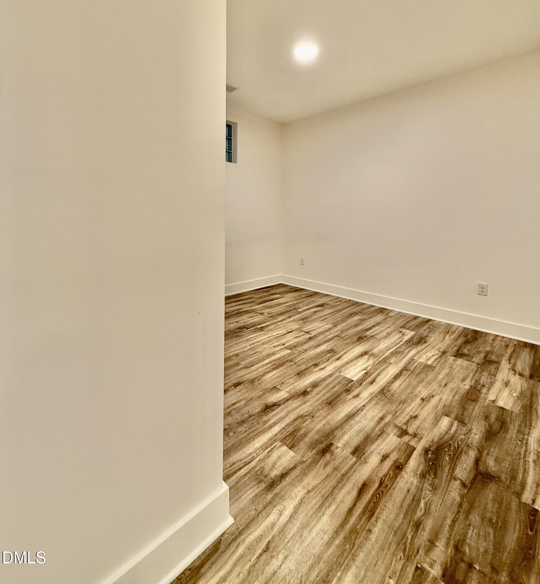 610 Trent Drive, Unit 403 Durham, NC 27705 - Photo 12 of 51 a view of empty room with wooden floor