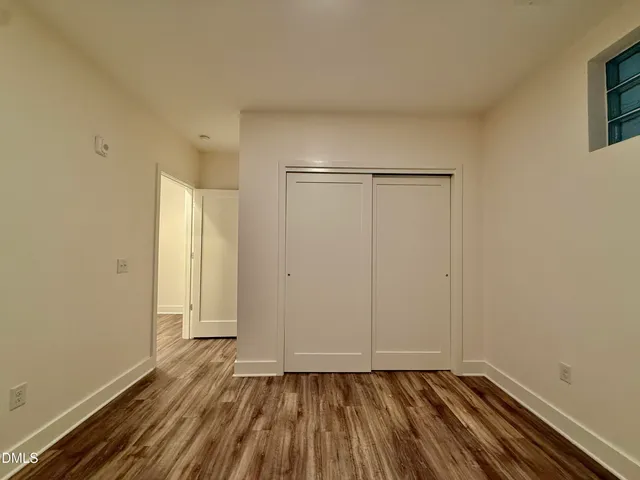 a bathroom with a double vanity sink toilet and shower
