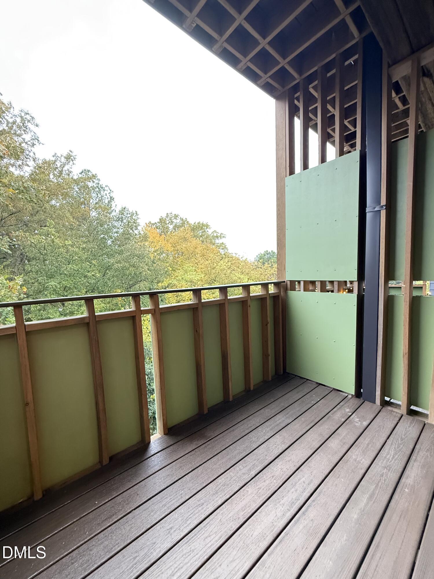 610 Trent Drive, Unit 403 Durham, NC 27705 - Photo 28 of 51 a view of a balcony with wooden floor