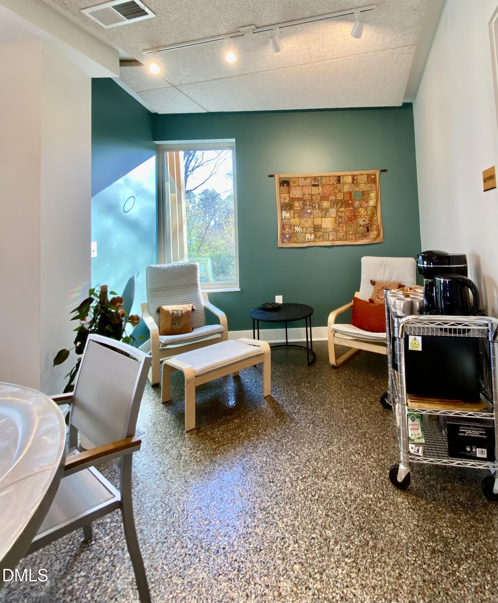 610 Trent Drive, Unit 403 Durham, NC 27705 - Photo 30 of 51 a bedroom with furniture and a flat screen tv