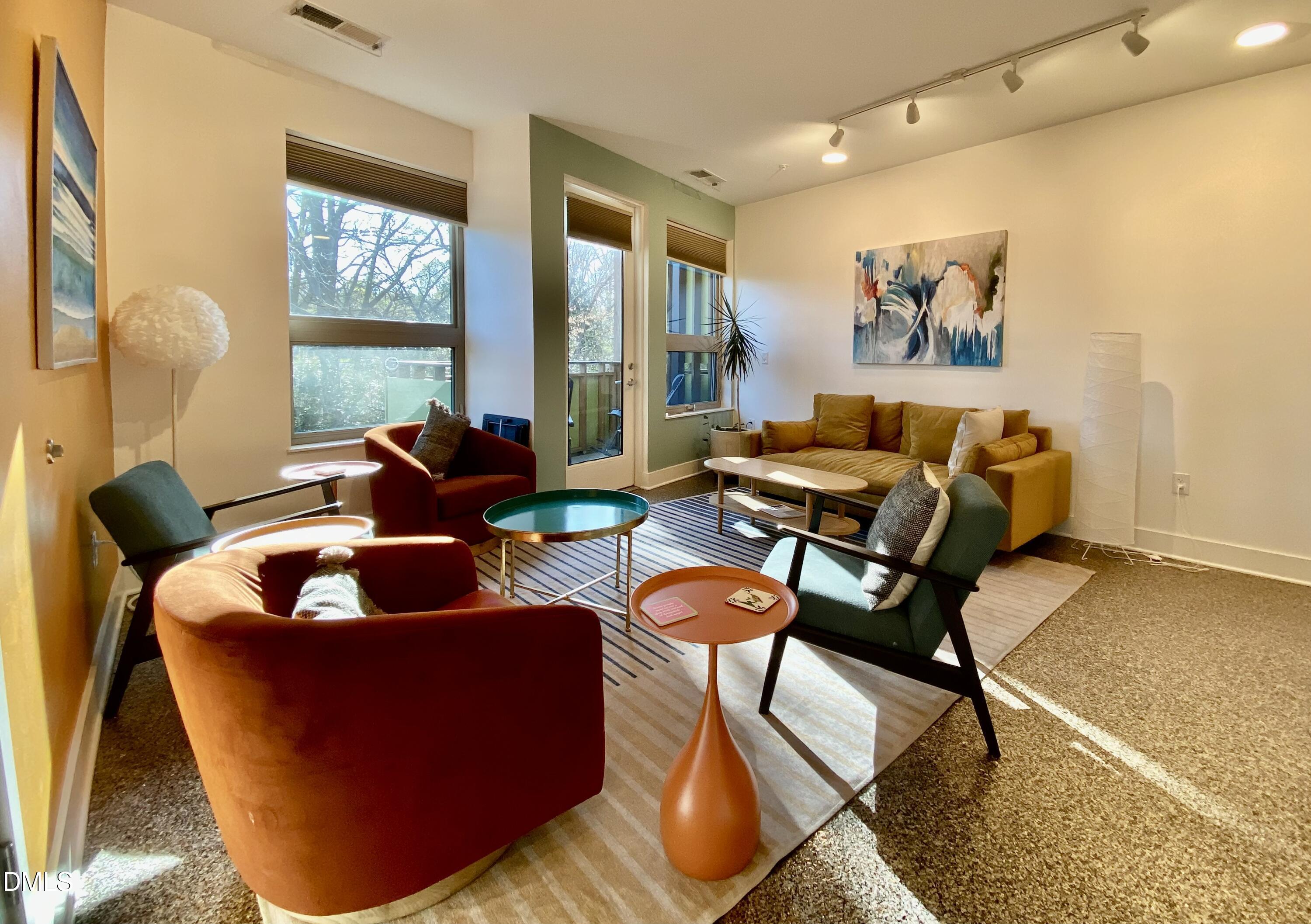 610 Trent Drive, Unit 403 Durham, NC 27705 - Photo 41 of 51 a living room with furniture and a large window