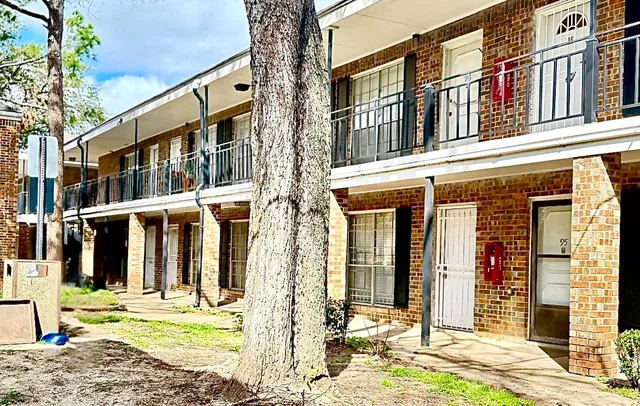 front view of a building with a fountain