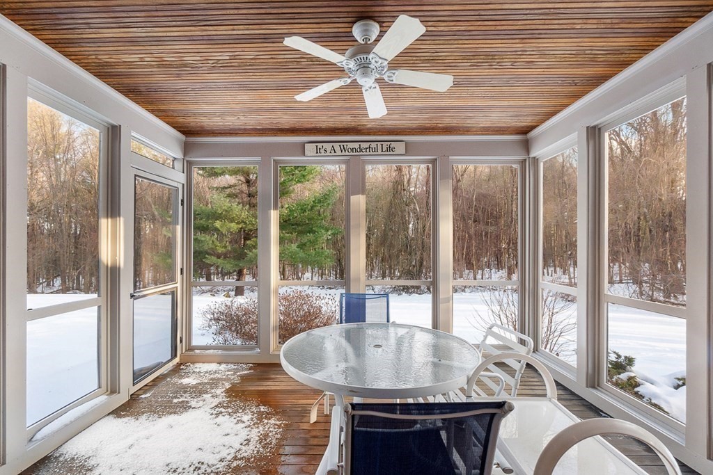 281 Taylor Road Stow, MA 01775 - Photo 33 of 42 a dining room with furniture a chandelier and fireplace
