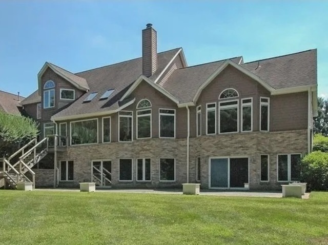 1504 Marshland Way, Unit BASMENT Bull Valley, IL 60098 - Photo 1 of 16 a front view of a house with a yard