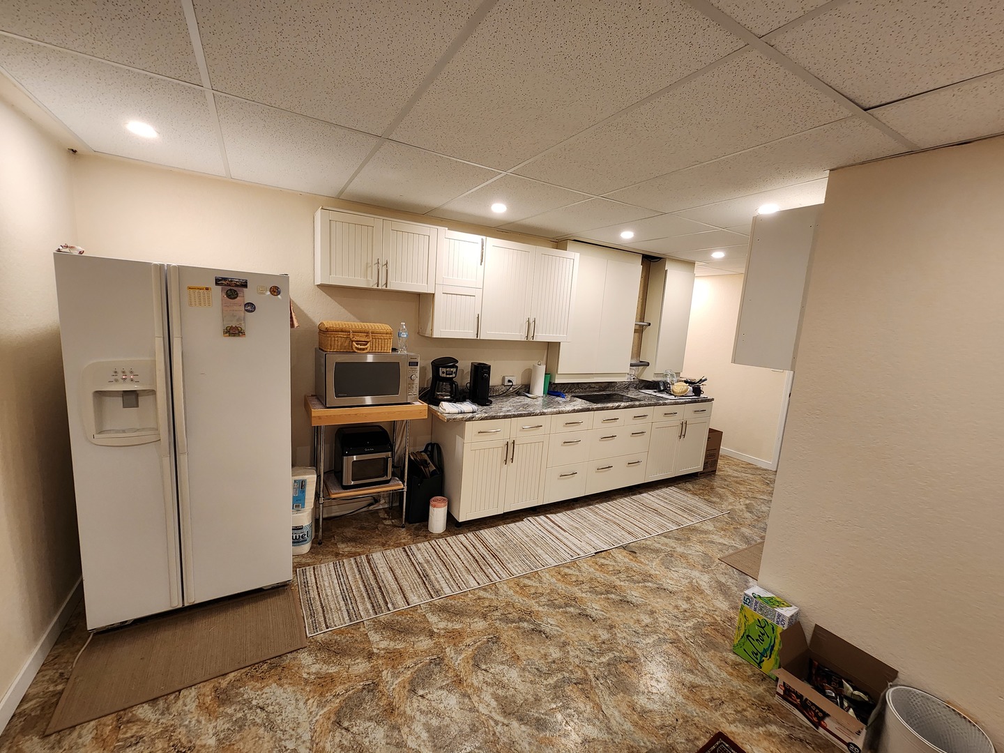 1504 Marshland Way, Unit BASMENT Bull Valley, IL 60098 - Photo 16 of 16 a view of a kitchen with refrigerator and windows