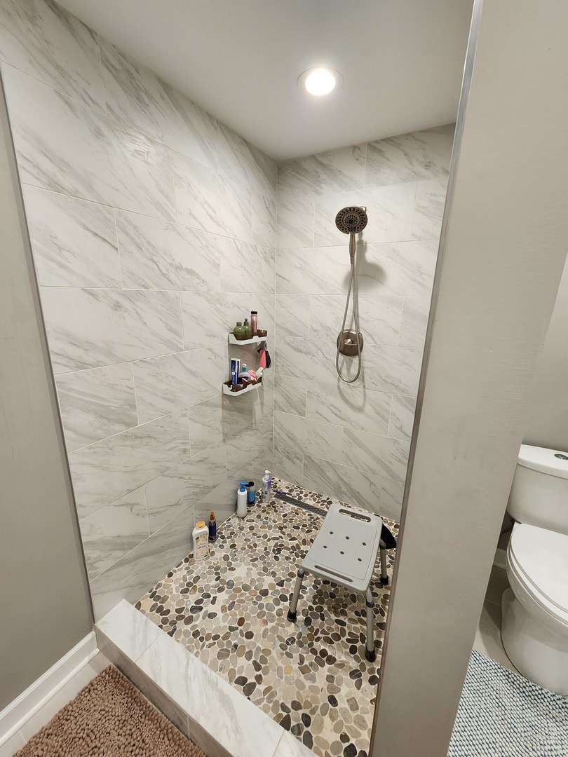 1504 Marshland Way, Unit BASMENT Bull Valley, IL 60098 - Photo 4 of 16 a bathroom with a sink and a toilet