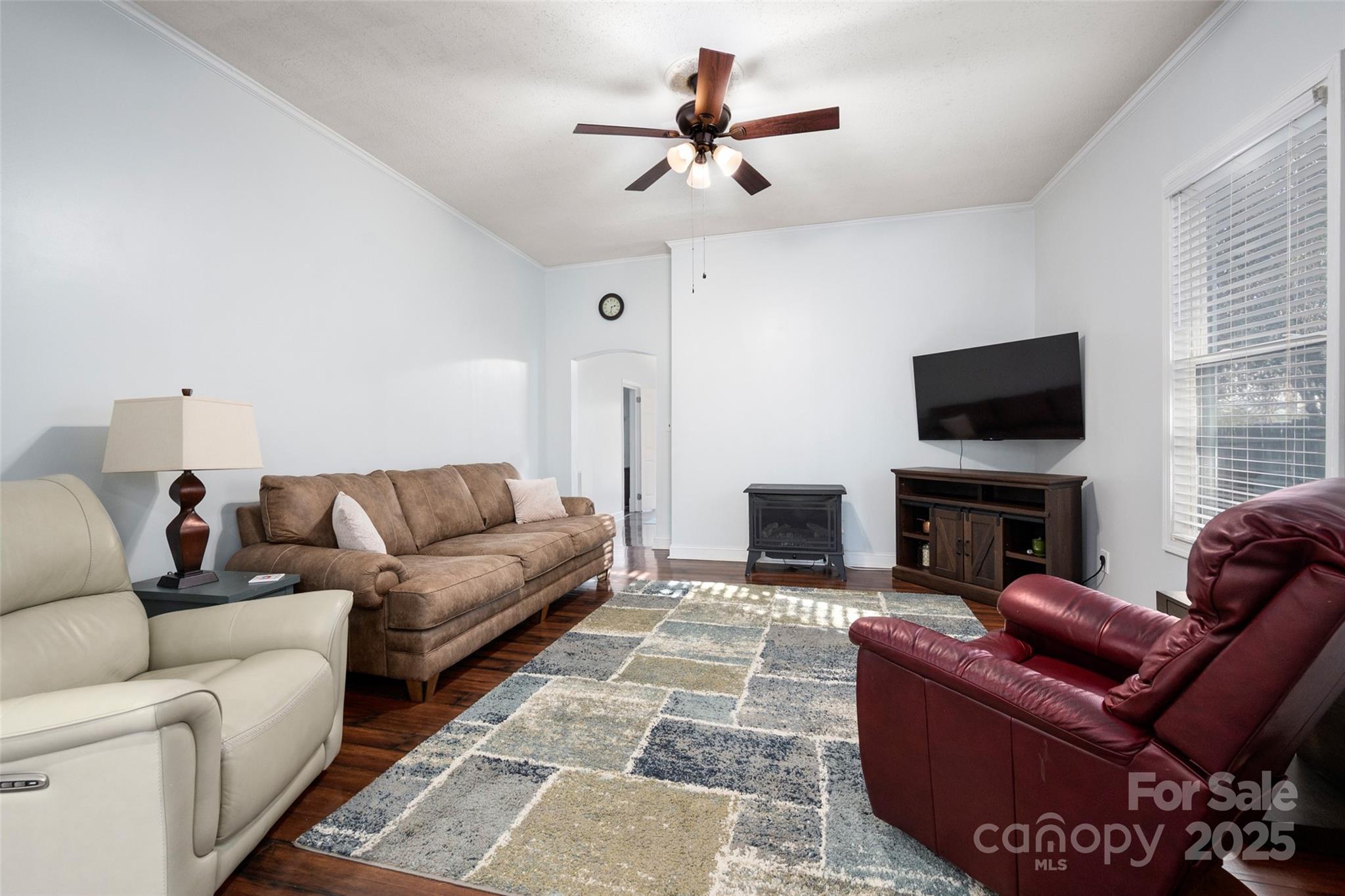 8 Cauthen Street Rock Hill, SC 29730 - Photo 12 of 36 a living room with furniture a fireplace and a flat screen tv