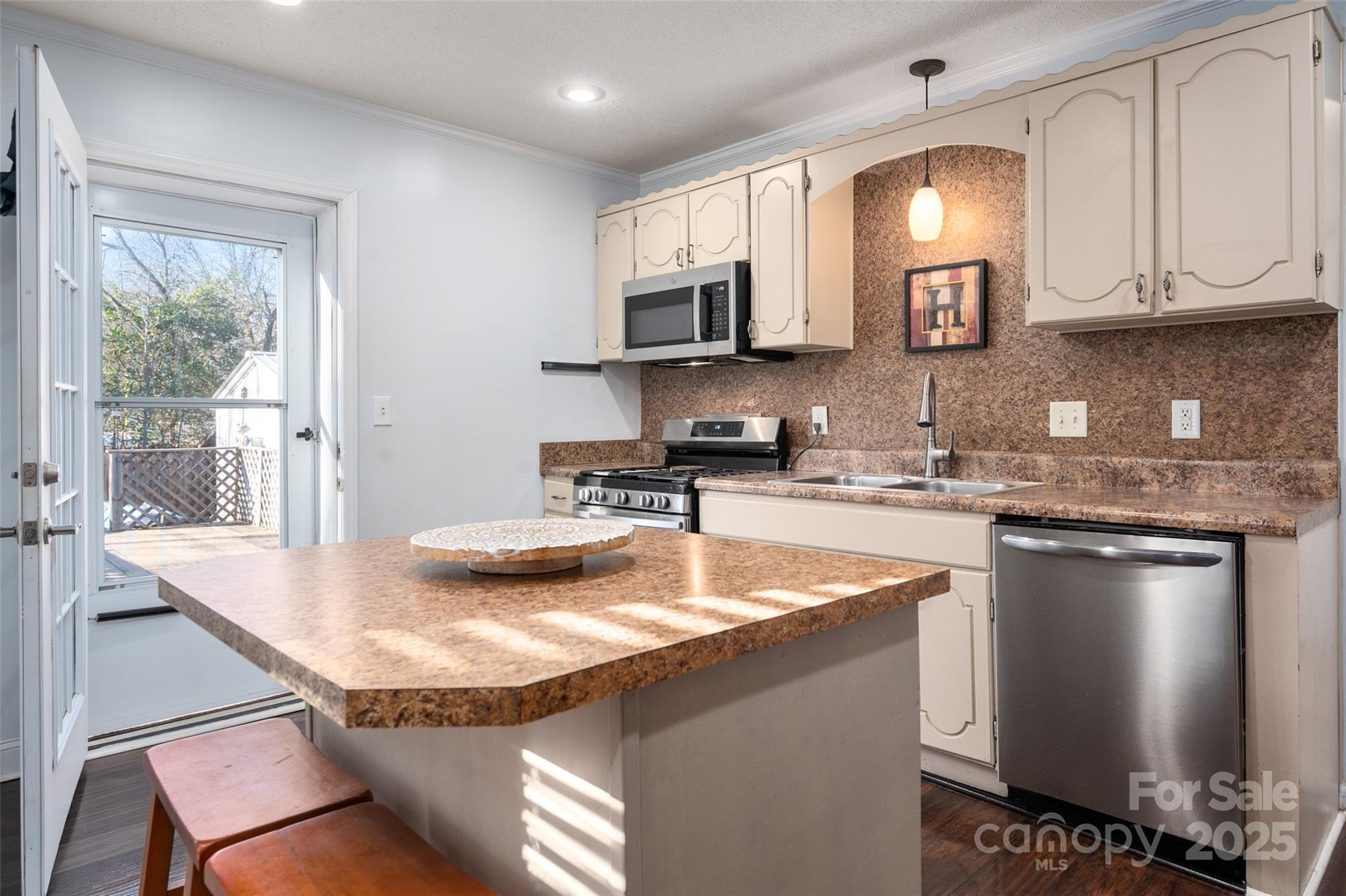 8 Cauthen Street Rock Hill, SC 29730 - Photo 16 of 36 a kitchen with stainless steel appliances granite countertop a sink a stove and a microwave