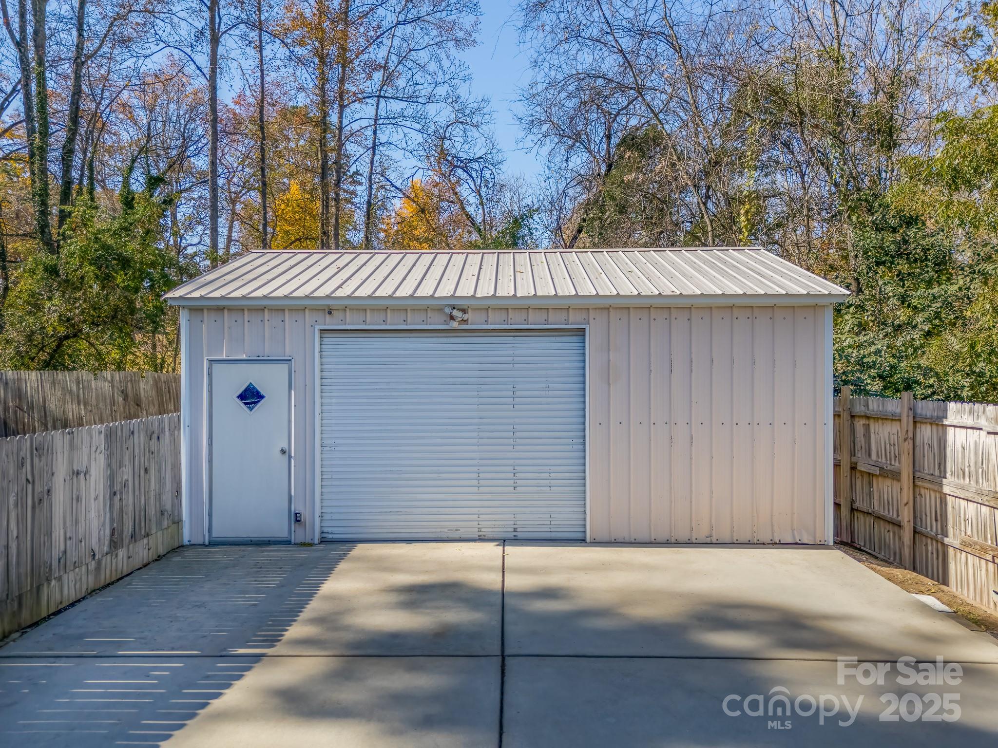 8 Cauthen Street Rock Hill, SC 29730 - Photo 33 of 36 a view of a house with a garage and wooden fence