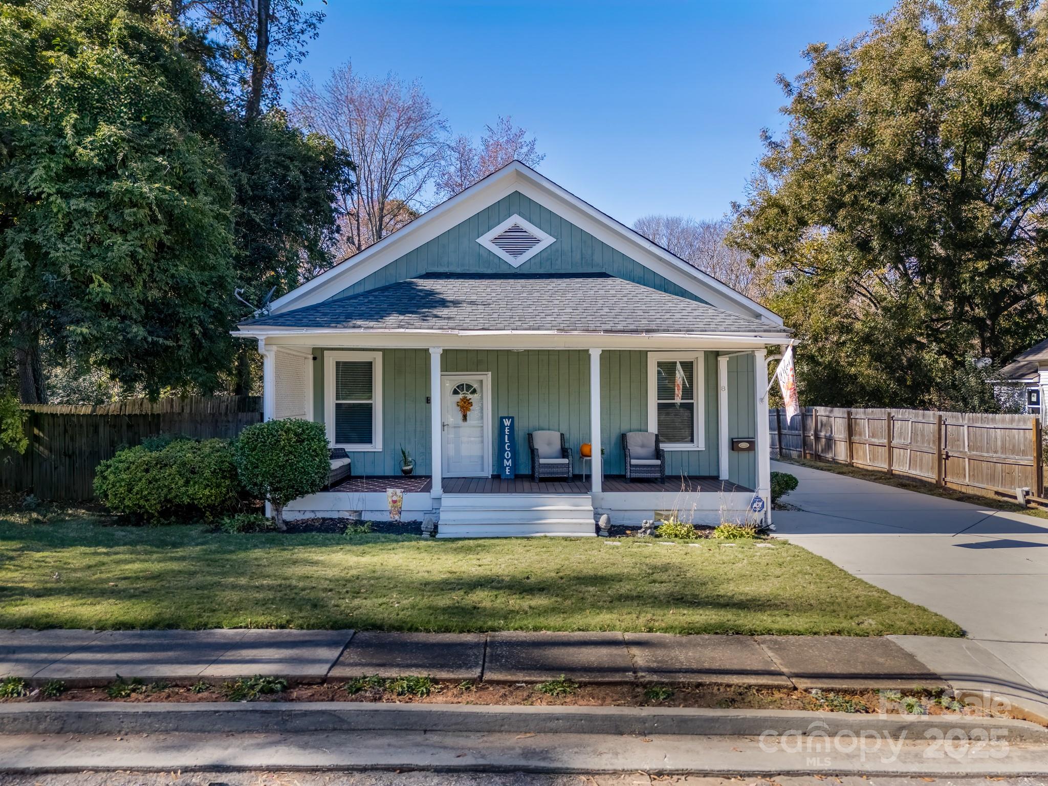 8 Cauthen Street Rock Hill, SC 29730 - Photo 5 of 36 a front view of a house with a yard table and chairs
