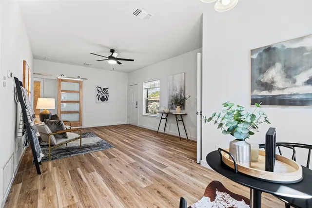 a living room with furniture and a window