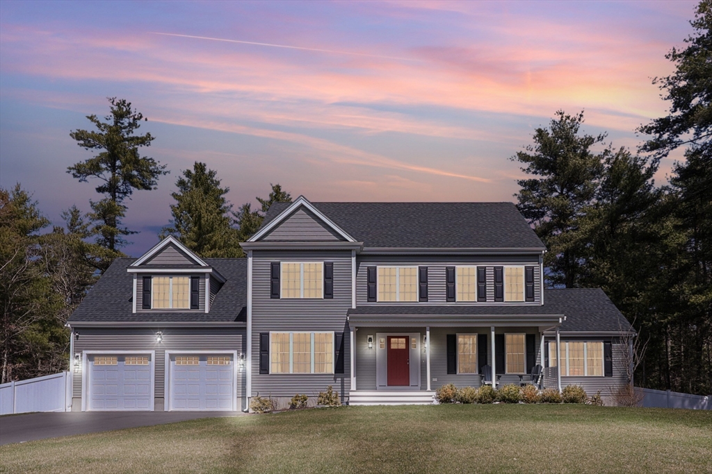 front view of a house with a garden