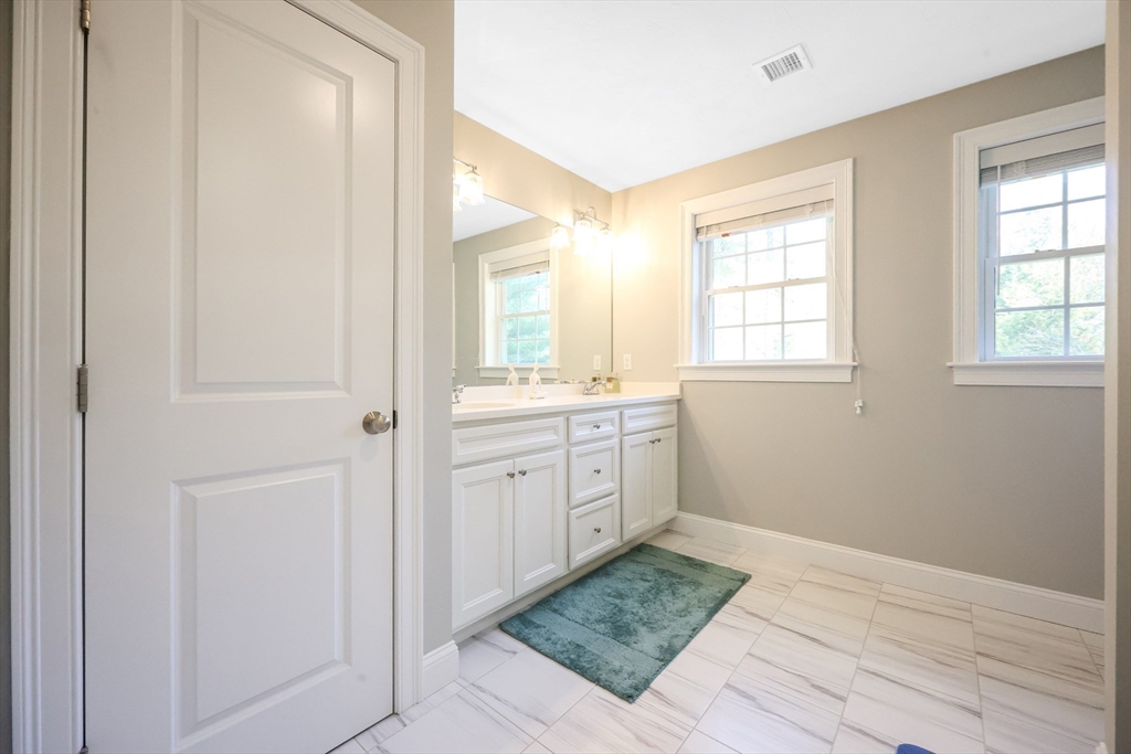27 Paddock Circle Middleboro, MA 02346 - Photo 21 of 35 a bathroom with a sink a window and a mirror