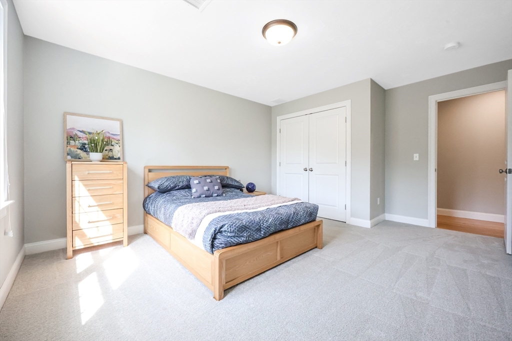 27 Paddock Circle Middleboro, MA 02346 - Photo 23 of 35 a spacious bedroom with a bed and a window