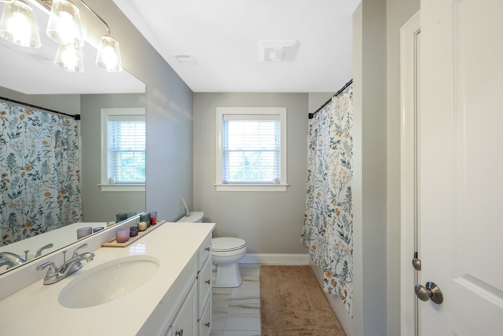 27 Paddock Circle Middleboro, MA 02346 - Photo 25 of 35 a bathroom with a sink a toilet and shower