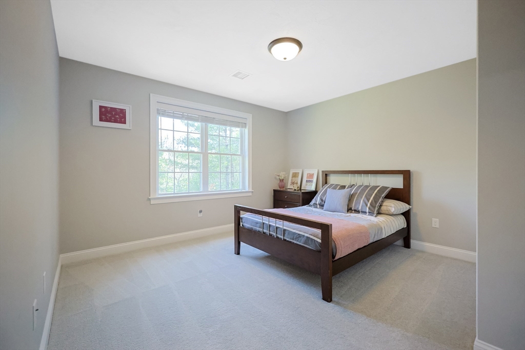 27 Paddock Circle Middleboro, MA 02346 - Photo 26 of 35 a spacious bedroom with a bed and a window