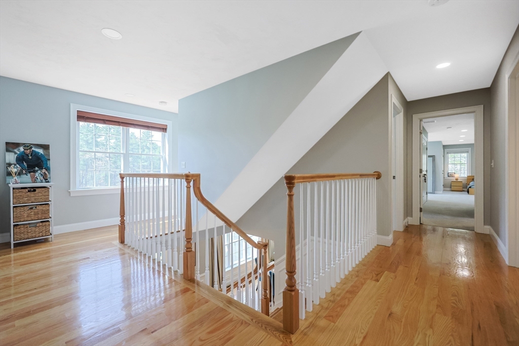 27 Paddock Circle Middleboro, MA 02346 - Photo 28 of 35 a view of a hallway with wooden floor and stairs
