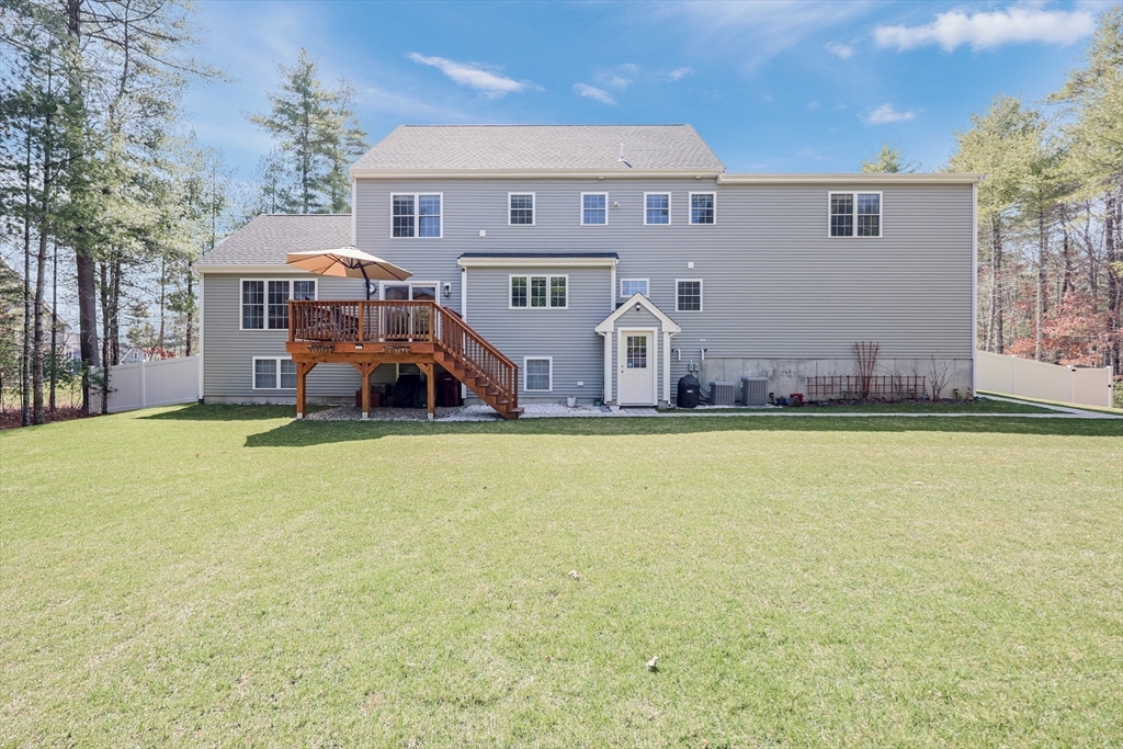 27 Paddock Circle Middleboro, MA 02346 - Photo 34 of 35 a front view of house with yard and seating area