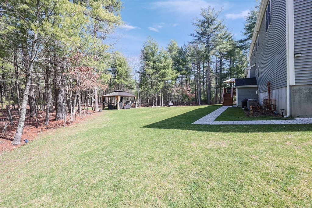 27 Paddock Circle Middleboro, MA 02346 - Photo 35 of 35 a view of a house with backyard porch and sitting area