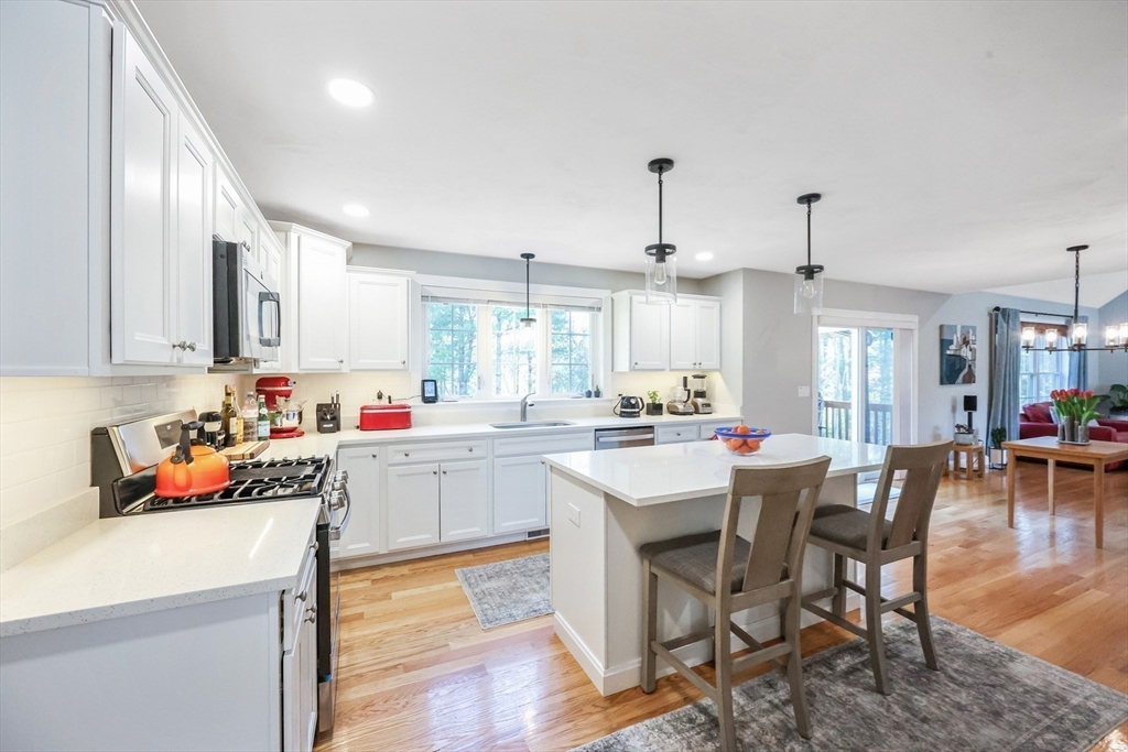 27 Paddock Circle Middleboro, MA 02346 - Photo 10 of 35 a kitchen that has a lot of cabinets a sink and appliances in it