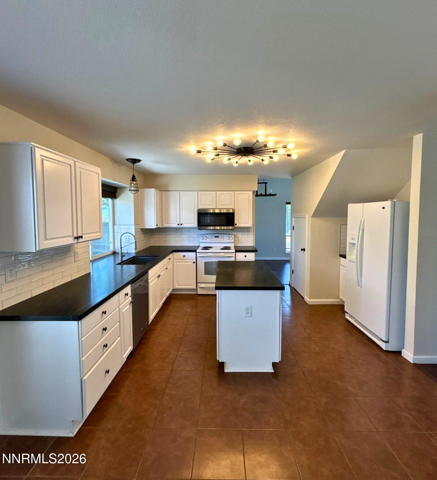4437 Highplains Drive Reno, NV 89523 - Photo 7 of 19 a large kitchen with cabinets