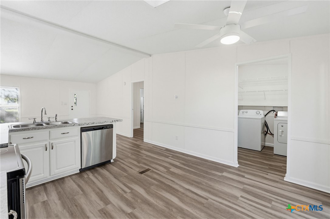 2739 Willow Loop Kempner, TX 76539 - Photo 12 of 30 a kitchen with sink a refrigerator and cabinets