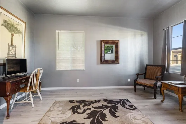 a bedroom with a workspace