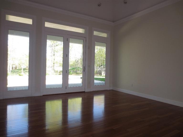 36 Open Space Drive Sandwich, MA 02563 - Photo 11 of 35 a view of empty room with wooden floor and fan