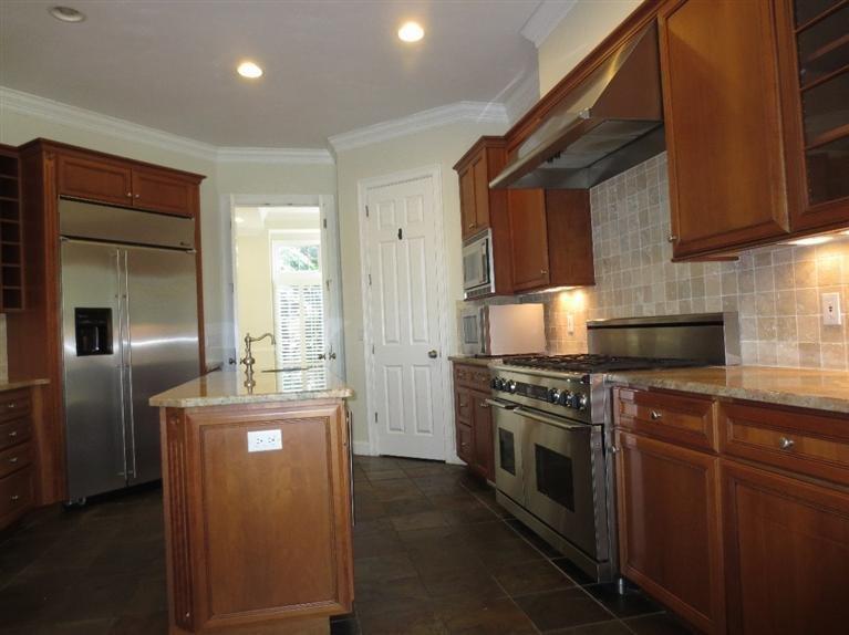 36 Open Space Drive Sandwich, MA 02563 - Photo 13 of 35 a kitchen with stainless steel appliances granite countertop a stove a refrigerator and a sink