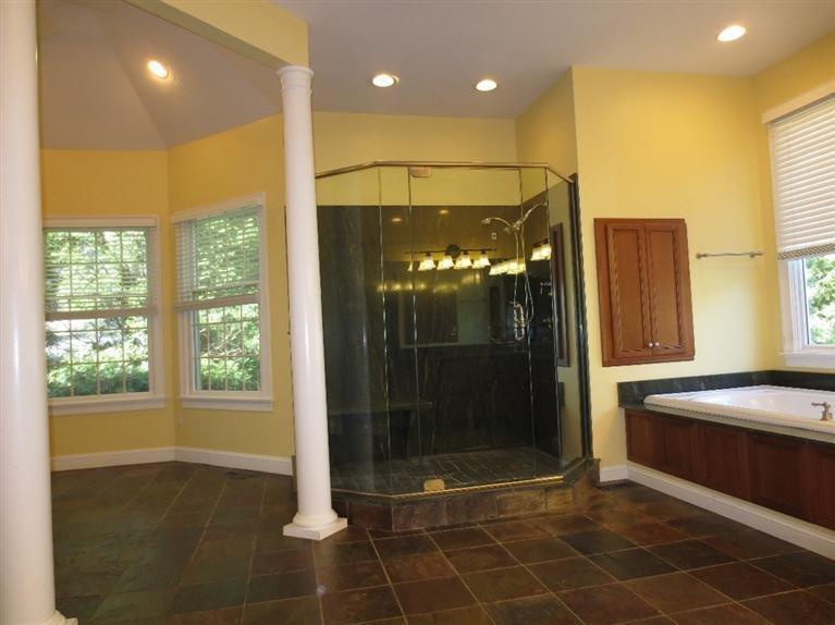 36 Open Space Drive Sandwich, MA 02563 - Photo 23 of 35 a bathroom with a glass shower door and a window