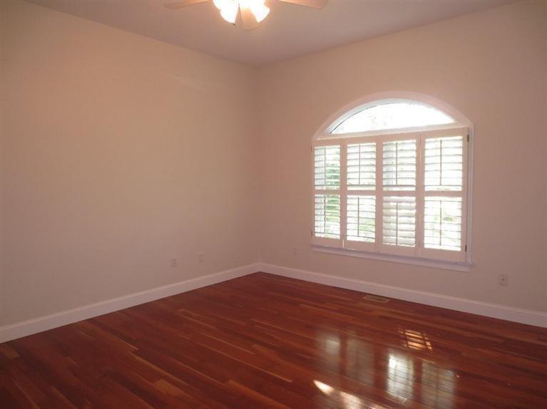 36 Open Space Drive Sandwich, MA 02563 - Photo 25 of 35 an empty room with wooden floor and windows