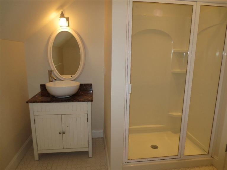 36 Open Space Drive Sandwich, MA 02563 - Photo 34 of 35 a bathroom with a sink and a mirror