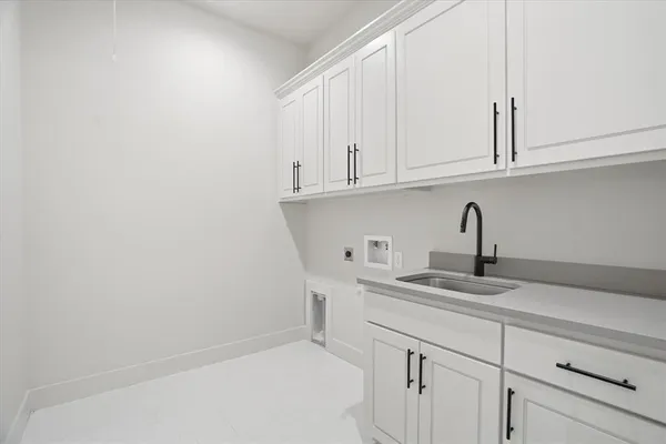 a kitchen with white cabinets