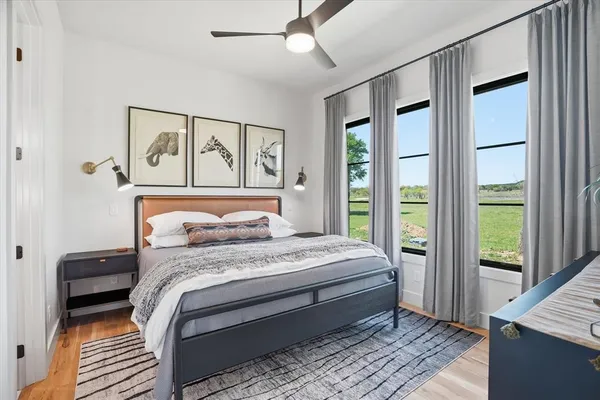 a bedroom with a large bed and a window