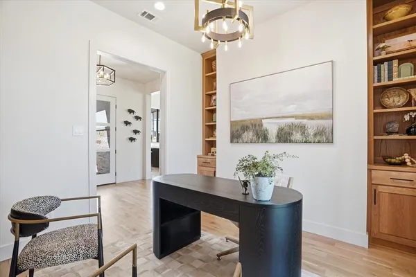 a dining room with furniture and wooden floor