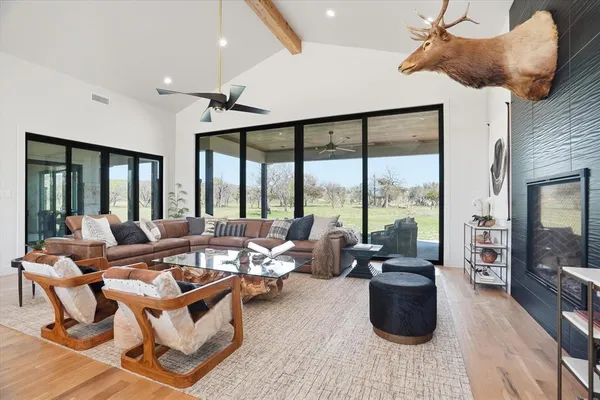 a living room with furniture and a large window